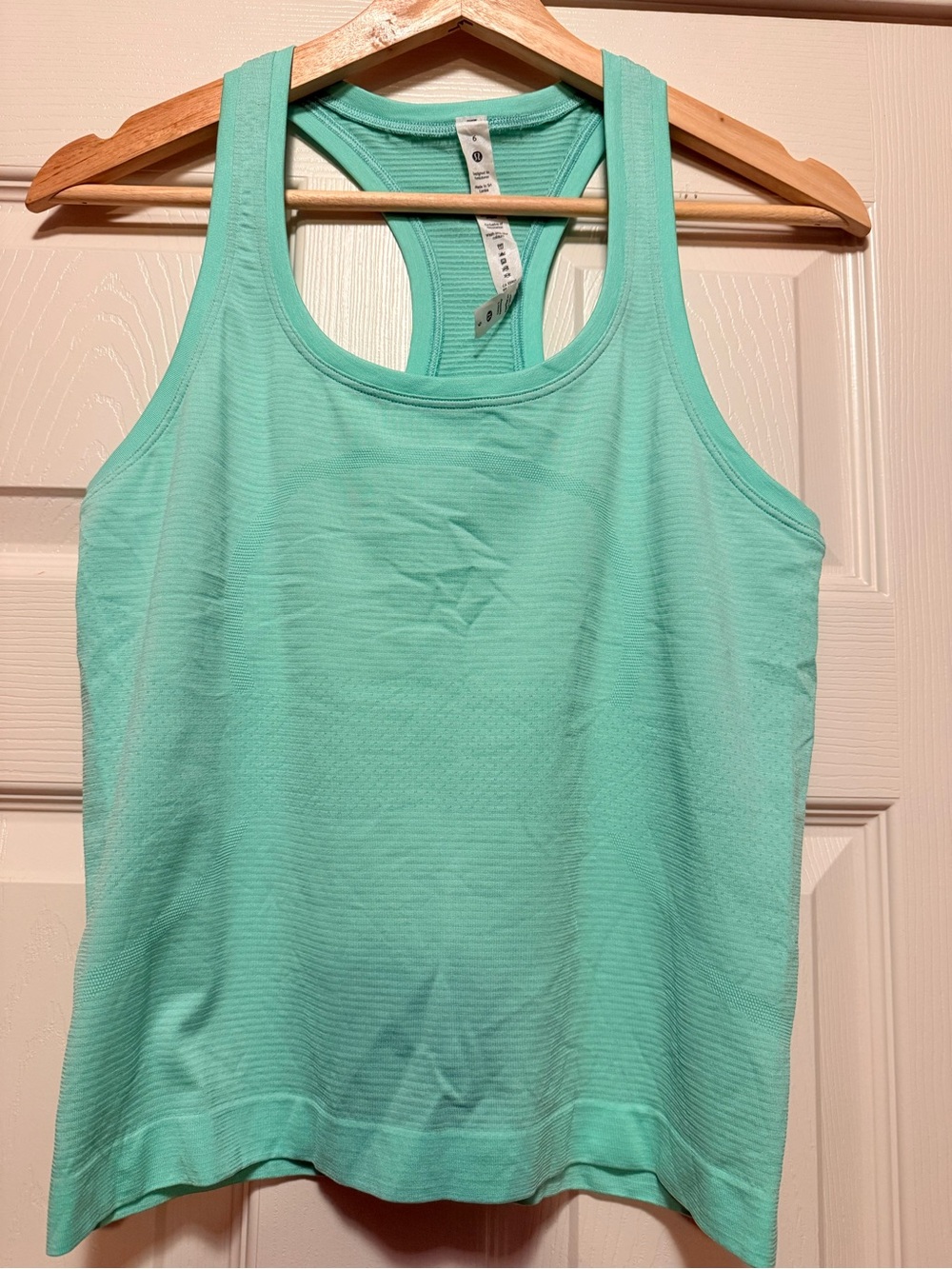 Women's Mint Green Racerback Tank Top swiftly